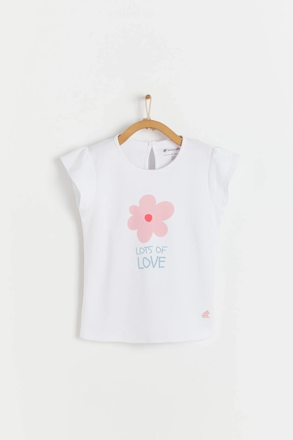 Flutter Short Sleeve Top with round necklace and flower printed at the front. Button at the back for easy fit. Made with pima cotton. Front view.