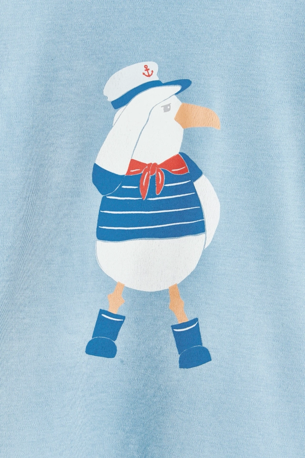 Short Sleeve Tee. Plain light blue with round necklace. Seagull printed at the back and pocket at the front. Back printed view.