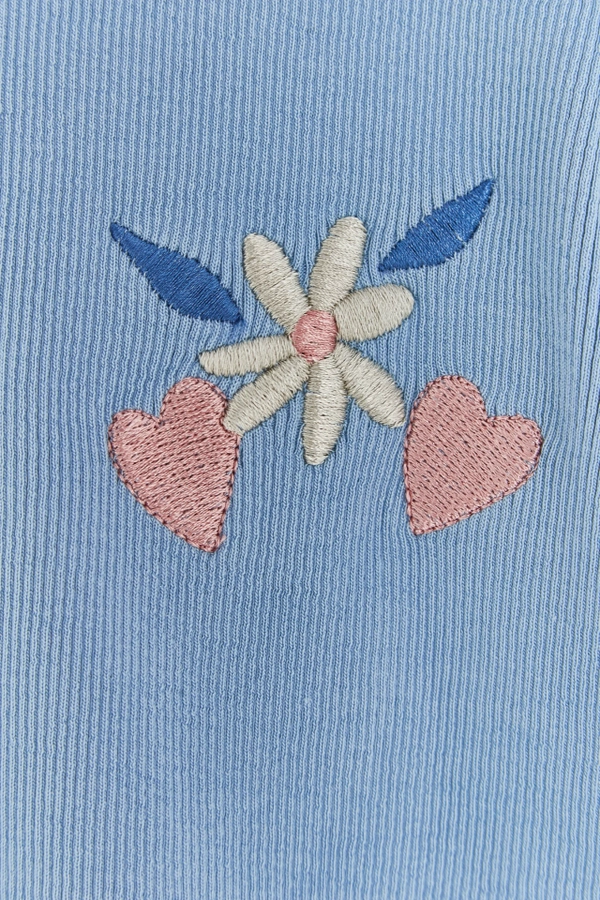 Ribbed Cotton Short Sleeve Top with embroidery at the front and button at the back for easy fit. Embroidery detail view.