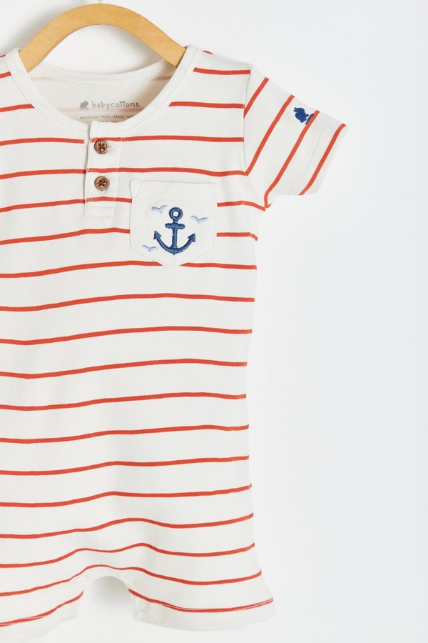 Striped Short Pocket Romper. Round necklace with buttons. Short sleeves and pocket at the front. Detail view