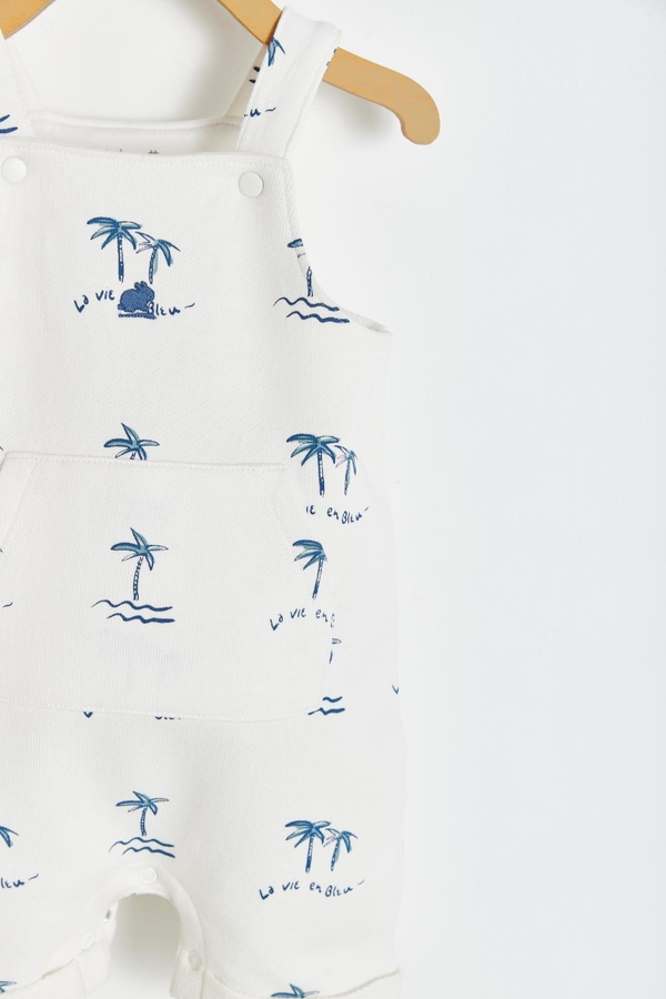 Palms Short Overall with buttoned straps and pockets at the front. Detail view